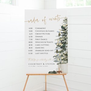 May include: A white sign with a watercolor illustration of a snowy pine tree. The sign lists the order of events for a wedding reception, including the ceremony, cocktails, dinner, first dance, speeches, cake cutting, dancing, sparkler send off, and last shuttle. The sign also includes the names Courtney & Steven and the date 8.19.2020. The sign is on a wooden easel.