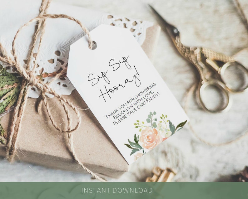 May include: A white gift tag with black calligraphy that reads "Sup Sup Hooray!" and "Thank you for showering Brooklyn with love. Please take one! Enjoy!" with a floral illustration in the bottom right corner.