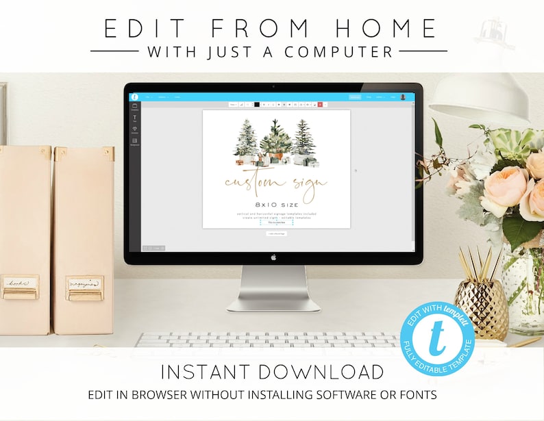 May include: A computer screen displaying a digital design template for a custom sign with a watercolor illustration of a winter forest scene. The text on the screen reads "custom sign 8x10 size". The screen is on a desk with a keyboard, a gold pineapple-shaped decorative object, and a bouquet of pink flowers.