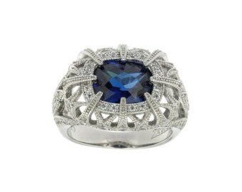 Silver Ring With Man Made Crystal Sapphire Center Stone CZ