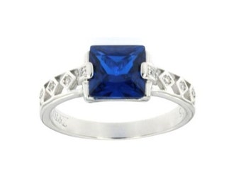 Silver Ring With Man Made Crystal Sapphire Center Stone CZ