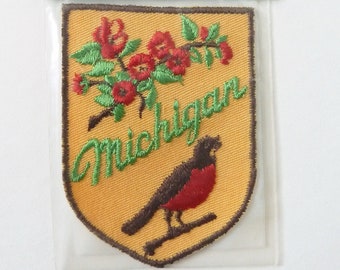 Vintage Michigan Travel Patch Featuring an American Robin and Apple Blossoms - Voyager Originals Souvenir Patch