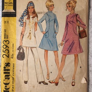May include: Vintage sewing pattern for a dress or top and pants. The pattern is for misses sizes 14 and 36 bust. The pattern is from McCall's and the pattern number is 2593. The pattern is for a step-by-step pattern.