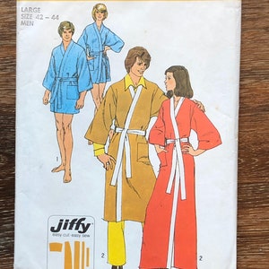 May include: Simplicity sewing pattern number 5685 for a robe. The pattern includes instructions for three robes, one in blue, one in brown, and one in red. The pattern is labeled "Jiffy easy cut-easy sew" and includes five main pattern pieces.