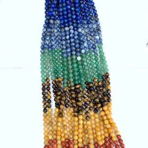 May include: A strand of gemstone beads in seven colors, including amethyst, lapis lazuli, sodalite, aventurine, tiger's eye, citrine, and red jasper.