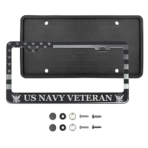 May include: A black and silver license plate frame with a US Navy Veteran inscription and an American flag design. The frame comes with two black plastic caps and four screws.