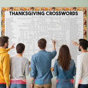 May include: A large Thanksgiving crossword puzzle with the words "THANKSGIVING CROSSWORDS" at the top. The puzzle is surrounded by a decorative border with fall-themed illustrations. Several people are gathered around the puzzle, pointing and writing.