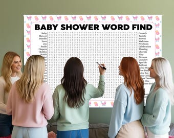May include: A baby shower word search game is displayed, surrounded by a group of women. The game board has a pink and white border with baby carriage illustrations and a word search grid with baby-related terms.