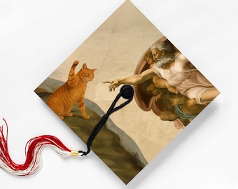 The Creation of CAt-dam, Funny Graduation Cap Topper Sticker, Orange Tabby Art Parody, 2026 Class