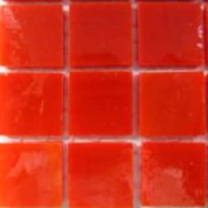 May include: Nine small, square, orange glass tiles.
