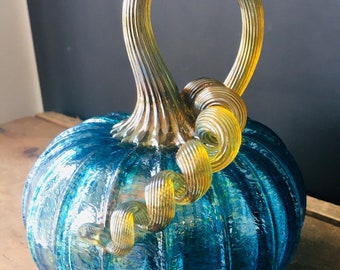 Iridescent aqua blue hand blown glass pumpkin with iridescent gold stem