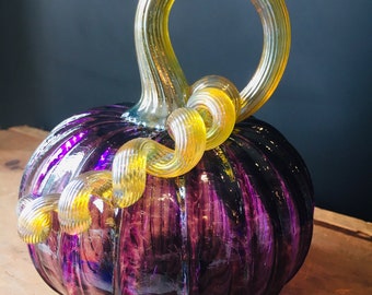 Purple jewel tone hand blown glass pumpkin with iridescent gold stem