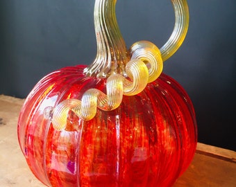 Cherry Red jewel tone hand blown glass pumpkin with iridescent gold stem