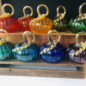 Jewel tone rainbow hand blown glass pumpkins with golden stems