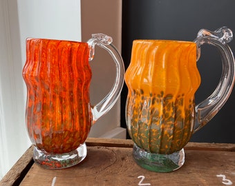 Hand blown glass mugs:  One of a kind mugs in orange with green accents