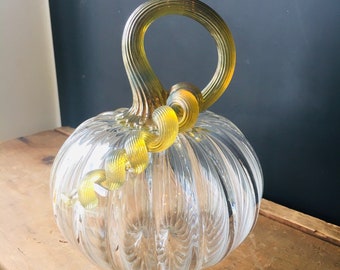 Clear round hand blown glass pumpkin with iridescent gold stem