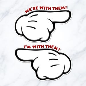 two cartoon-style hand stickers with the text "We're with them!" and "I'm with them!" written on them.