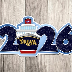 A sticker with the number "26" and a ship design, representing the year "2016".