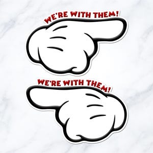 two cartoon-style hand pointing stickers with the text "We're with them!" written above them.