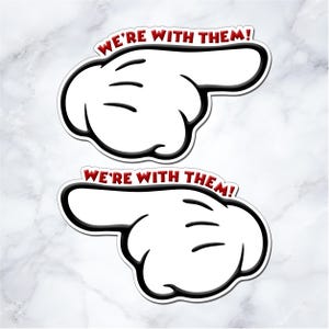 two cartoon-style hand pointing stickers with the text "We're with them!" written above them.