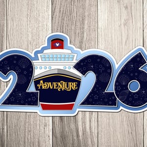 A sticker with the number "26" and a ship illustration, representing the year "2016".