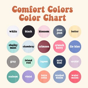 May include: Color chart showing 20 different colors offered by Comfort Colors. The colors are arranged in four rows of five circles, each circle displaying a color name and a swatch of the color.