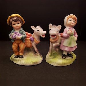 Norleans Figurines Boy and Girl With Donkeys Carrying Fruit