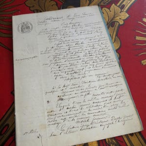 May include: A close-up of a handwritten document with a seal in the top left corner. The document is written in French and appears to be a marriage certificate. The text reads "Tarcevant, A 25 Juin 1818, Out lempar..."