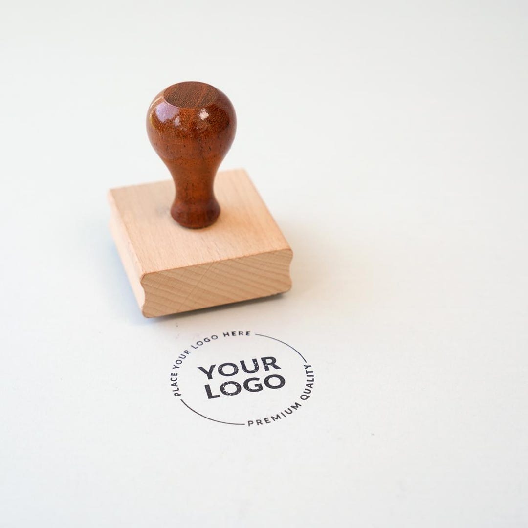 Real custom wooden-handle rubber stamp with logo impression