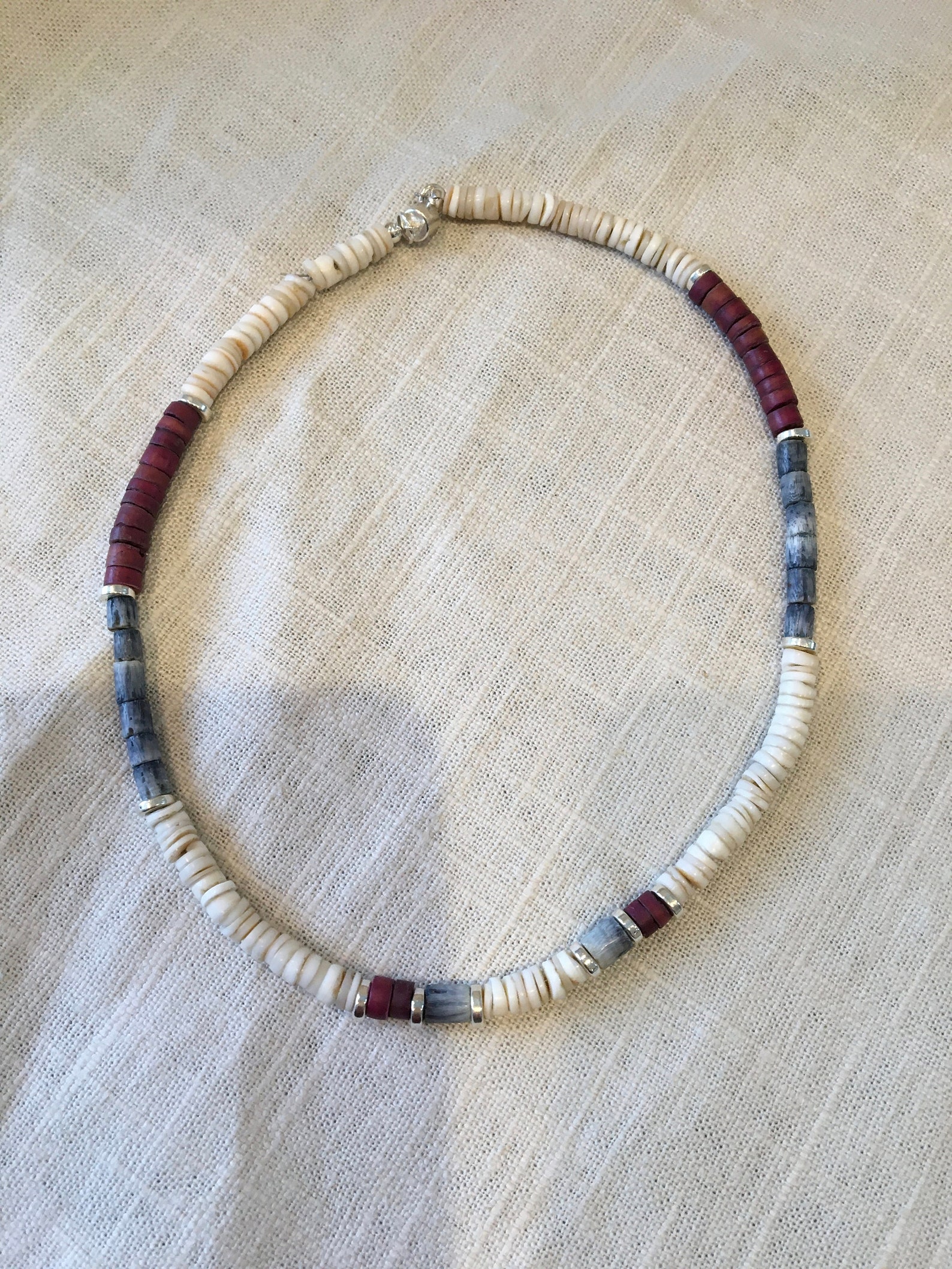 Heishi beaded necklace in three colors with silver highlights. Etsy