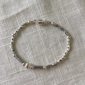 Silver beaded bracelet with an easy-on magnetic clasp.