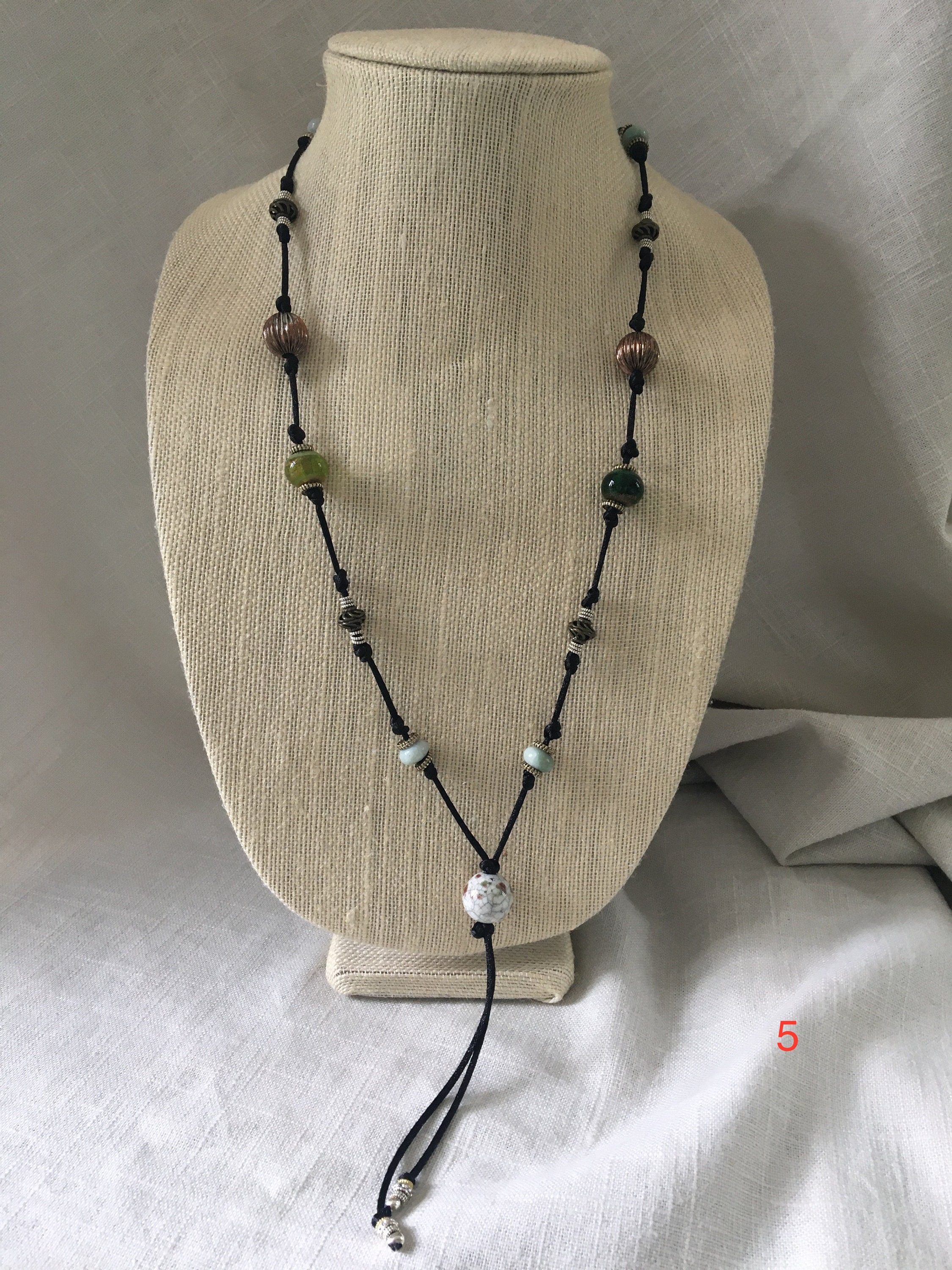 Popular knotted beaded necklaces with gold and silver accents. | Etsy