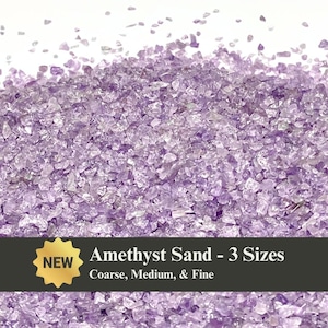 May include: A close-up of amethyst sand in various sizes, with a light purple hue. The image features a pile of crushed amethyst crystals, with a banner that reads "Amethyst Sand - 3 Sizes: Coarse, Medium, & Fine" and a "NEW" sticker.