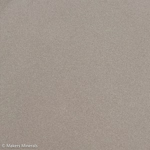 May include: A close-up of a light gray textured surface. The surface has a fine, even grain.