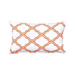 May include: White rectangular pillow with an orange geometric pattern.