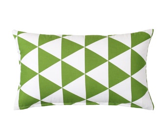 May include: A green and white geometric patterned throw pillow. The pillow is rectangular and has a white background with green triangles.