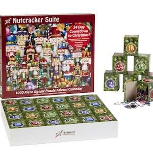 May include: A 1000 piece jigsaw puzzle advent calendar featuring a Nutcracker Suite theme. The box is open to reveal the 24 individual puzzle pieces, each with a number from 1 to 24. The box also includes a 24-day countdown to Christmas.