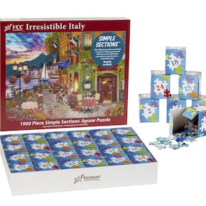May include: A 1000 piece jigsaw puzzle of an Italian village scene with a mountain in the background. The puzzle is divided into 24 sections, each with a number on it. The puzzle is in a box with the words "Irresistible Italy" and "Simple Sections" on it.