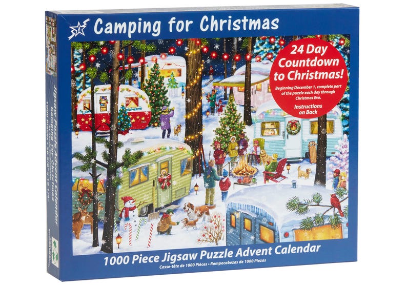May include: A 1000 piece jigsaw puzzle advent calendar featuring a winter camping scene with Christmas lights, decorated campers, and a campfire. The box has the text "Camping for Christmas" and "24 Day Countdown to Christmas!"