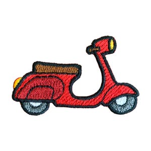 May include: Red embroidered iron-on patch of a scooter with a brown seat and yellow headlights.