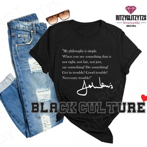 May include: Black crew neck t-shirt featuring the text "My philosophy is simple" and a signature. The words "BLACK CULTURE" are printed below the shirt. A pair of blue jeans and sunglasses are also in the image.
