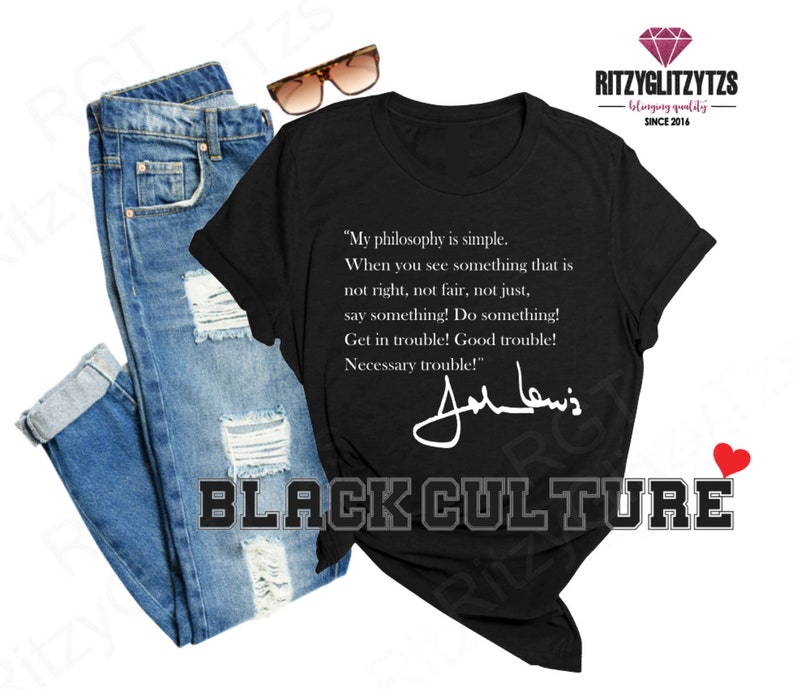 May include: Black crew neck t-shirt featuring the text "My philosophy is simple" and a signature. The words "BLACK CULTURE" are printed below the shirt. A pair of blue jeans and sunglasses are also in the image.