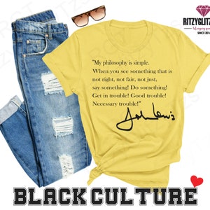 May include: A yellow t-shirt featuring a quote by John Lewis and his signature, paired with blue jeans and sunglasses. The words "BLACK CULTURE" are printed at the bottom. The t-shirt's quote reads "My philosophy is simple..."
