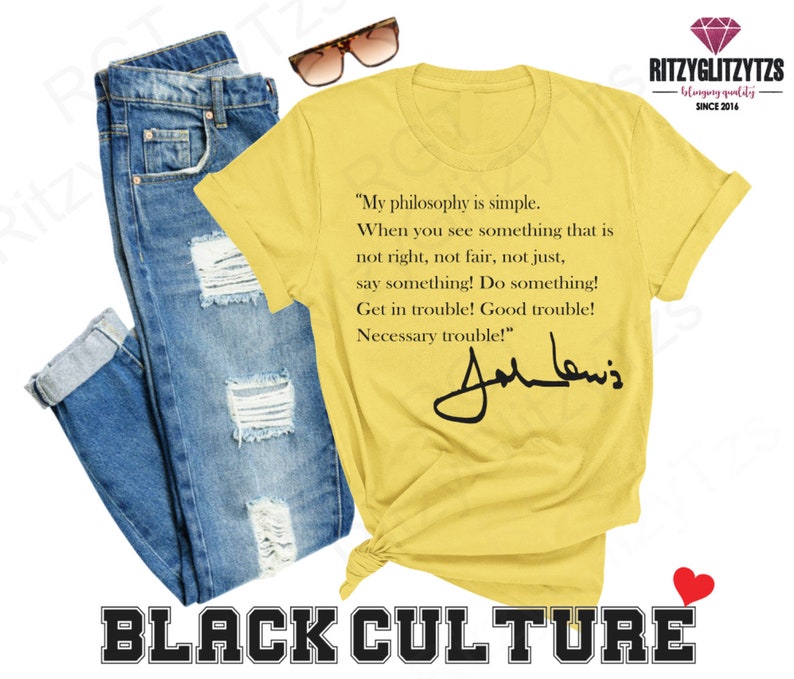 May include: A yellow t-shirt featuring a quote by John Lewis and his signature, paired with blue jeans and sunglasses. The words "BLACK CULTURE" are printed at the bottom. The t-shirt's quote reads "My philosophy is simple..."