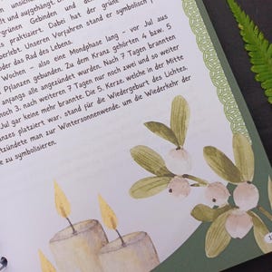 May include: Three white candles with yellow flames are lit. The candles are in front of a green background with a sprig of holly with white berries.