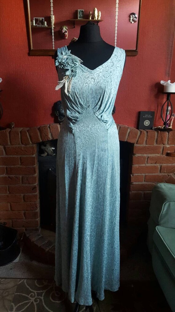 A beautiful blue cold rayon taffeta 1930s gown