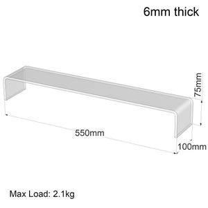 May include: A clear acrylic display stand, measuring 55cm long, 10cm wide, and 7.5cm high, with a 6mm thickness. The stand can hold a maximum load of 2.1kg. The design features rounded corners and is suitable for showcasing products.