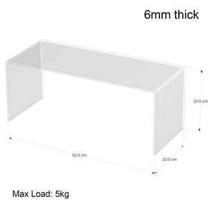 May include: A clear acrylic display stand, measuring 50.0 cm long, 20.0 cm wide, and 20.0 cm high, with a thickness of 6mm. It can support a maximum load of 5kg. The stand has a simple, rectangular design.