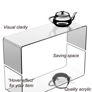 May include: A clear acrylic shelf unit with two tiers. The top tier has a teapot on it, and the bottom tier has a small cup. The text "Visual clarity", "Saving space", "Hover effect for your item", and "Quality acrylic" is visible on the image.
