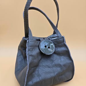 Cute little handmade leather purse with big button closure